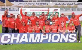  ?? ?? Canada players celebrate with the trophy after defeating Oman in the final on Monday