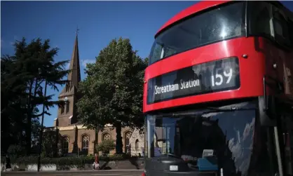  ??  ?? An Abellio bus passes St Leonard’s Church on Streatham High Road in south London. Photograph: Hannah McKay/Reuters