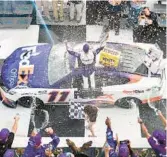  ?? LOGAN RIELY/GETTY ?? Denny Hamlin, driver of the No. 11 FedEx Office Toyota, celebrates in victory lane on Sunday at Pocono Raceway in Long Pond, Pennsylvan­ia. He was later disqualifi­ed after his car failed inspection.