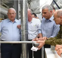  ?? (Mark Neyman/GPO) ?? PRESIDENT REUVEN Rivlin and Finance Minister Moshe Kahlon are briefed at the Kalandiya Crossing yesterday.