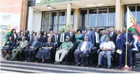 ?? ?? Twenty-three newly sworn in magistrate­s pose for a picture with other Judicial Service Commission stakeholde­rs led by Chief Magistrate Ms Faith Mushure (seated centre)