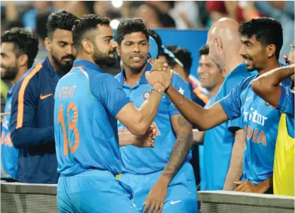  ??  ?? PUNE: India’s captain Virat Kohli celebrates after India won the first one-day internatio­nal cricket match against England at The MCA Internatio­nal Cricket Stadium in Pune yesterday. — AFP