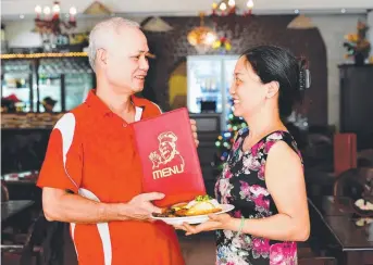  ??  ?? Owner of Non La Restaurant Marh Hoary and Thuy Nguyen with one of their dishes Picture: KERI MEGELUS