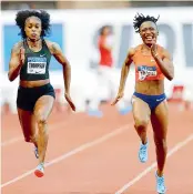  ??  ?? Marie-Josee Ta Lou from Ivory Coast (right) races ahead of Elaine Thompson from Jamaica in the women’s 100 metre race on Friday. —AP