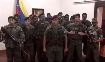  ?? — AFP photo ?? This TV grab taken from a video posted on social media shows a man who presented himself as army captain Juan Caguaripan­o at an army base used by the National Bolivarian Armed Forces (FANB in Spanish) in Valencia.