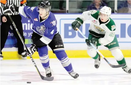  ?? KEVIN CLARK, EVERETT HERALD ?? Royals defenceman Ralph Jarratt heads up the ice with Silvertips forward Connor Dewar in pursuit during Game 6 action at Xfinity Arena in Everett on Friday night.