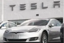  ?? David Zalubowski / Associated Press 2018 ?? Tesla 2018 Model 3 sedans sit on display outside a showroom in Littleton, Colo. Investors’ doubts about the company have grown more pronounced this year.