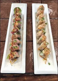  ?? Arkansas Democrat-Gazette/SHEA STEWART ?? The specialty roll menu at Kamikaito contains more than 30 rolls, including the chile tai (left) and the Mt. Pinnacle.