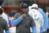  ?? PETER JONELEIT — THE ASSOCIATED PRESS, FILE ?? Chargers head coach Anthony Lynn calls in a play against the Falcons on Sunday in Inglewood.