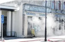  ?? PHOTO: ASHLEY SMYTH ?? Lucky escape . . . Nobody was injured as fire crews responded to a fire at Grave’s Saddlery on Oamaru’s Thames Street yesterday.