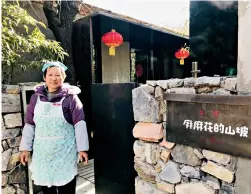  ??  ?? The job in the homestay has greatly helped model housekeepe­r Cai Jinglan to support her family.