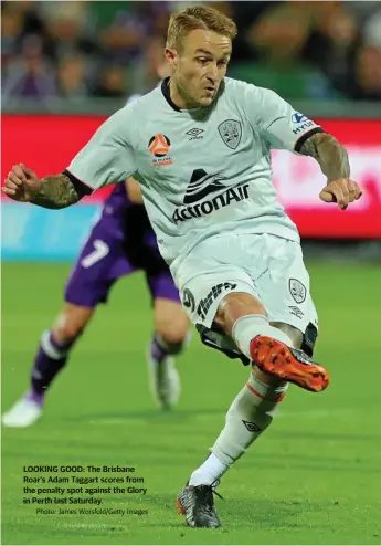  ?? Photo: James Worsfold/Getty Images ?? LOOKING GOOD: The Brisbane Roar’s Adam Taggart scores from the penalty spot against the Glory in Perth last Saturday.