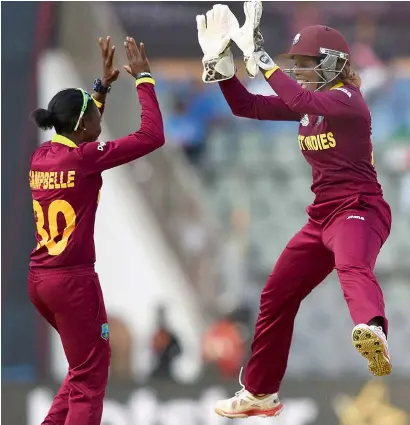  ??  ?? West Indies women celebrate the wicket of Sara McGlashan during the Women’s WT20 match against New Zealand. —