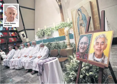  ?? REUTERS ?? Jesuit priests hold a mass at a church in Mexico City next to the photos of two priests, Javier Campos and Joaquin Mora, murdered in Chihuahua state.