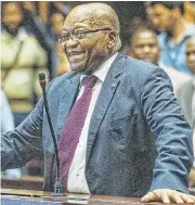  ?? /AFP ?? Holding on: Former president Jacob Zuma appears in the high court in Pietermari­tzburg, KwaZulu-Natal, on corruption charges in October.