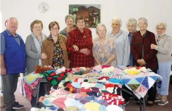  ?? ?? Bobby Were, coordinato­r of the TLC ward, with the ladies who knitted for the children in the cancer ward.