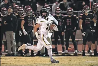  ??  ?? AS HE runs for his touchdown, Moon looks to the sidelines and his teammates. “I love those boys with all my heart,” he said. “I couldn’t have gotten through this without them.”