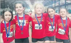  ?? ?? Siún, Molly, Aoife, Beth and Eva show off their silver relay medals in U11.