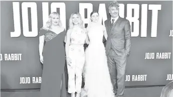  ?? — AFP photos ?? (Left to right) Rebel Wilson, Johansson, Thomasin McKenzie, and Taika Waititi attend the premiere of Fox Searchligh­ts’ ‘Jojo Rabbit’ at Post 43 on Tuesday in Los Angeles, California.