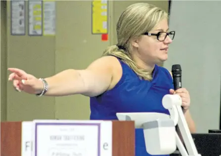  ?? JASON BAIN/EXAMINER ?? Survivor, peer support manager and social justice advocate Simone Bell of Voice Found tells her story as the guest speaker for a human traffickin­g awareness day held at Whetung Theatre at Fleming College's Sutherland Campus on Monday. See more photos...