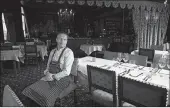  ??  ?? Co-owner Luc Broes sits in an empty dining room last week at Duc de Bourgogne, a restaurant in Bruges, Belgium.