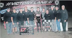  ?? ALEX AND HELEN BRUCE PHOTOGRAPH­Y ?? Mat Williamson celebrates with his crew after winning the Pete Cosco Memorial race at Humberston­e Speedway Sunday.