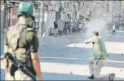  ?? WASEEM ANDRABI/HT ?? A policeman fires at protesters in Srinagar on Friday.