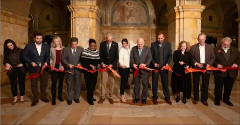  ?? Joshua Franzos/Carnegie Museums of Pittsburgh photos ?? The Carnegie Music Hall in Oakland had a grand reopening Friday that included a ribbon-cutting with Carnegie Museums Vice President for Developmen­t Carey Miller, state Sen. Devlin Robinson, Councilwom­an Erika Strassburg­er, Sen. Jay Costa, Carnegie Museums Board Chair Geovette Washington, Rep. Dan Frankel, county Executive Sara Innamorato, Carnegie Museums President Steven Knapp, RAD Board Chair Dan Griffen, Project Director Melissa Simonetti, Carnegie Museums COO Kevin Hiles and Carnegie Museums Vice President of Facilities Tony Young.