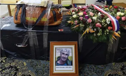  ?? Photograph: Farouk Batiche/AFP/Getty Images ?? The backpack of Herve Gourdel sits on his coffin before it is flown to Paris in 2015.