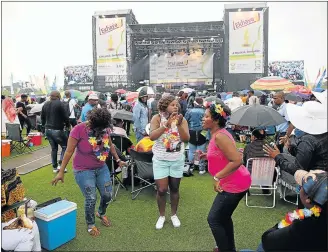  ?? Picture: MARK ANDREWS ?? PUMP UP THE MUSIC: Thousands of people from all corners of the country braved the rainy weather to see some of the country’s biggest acts perform live at the annual Buyel'Ekhaya Pan African Music festival at Buffalo Park Cricket stadium last week