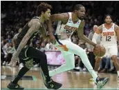  ?? CHRIS CARLSON — THE ASSOCIATED PRESS ?? Phoenix forward Kevin Durant, driving to the basket Wednesday, scored 23 points in his debut with the Suns.