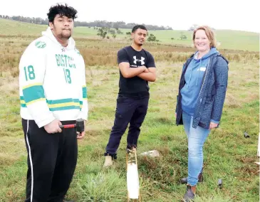  ??  ?? Above: Personal developmen­t skills VCAL teacher Brigitte Krstic at the tree planting program with students Joshua Glover (left) and Vincent Hau Kautai.