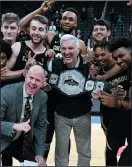  ?? ETHAN MILLER/GETTY IMAGES ?? George Kliavkoff, center, then with MGM Resorts, presents the Colorado Buffaloes with the MGM Resorts Tournament championsh­ip belt on Nov. 26, 2019 in Las Vegas.
