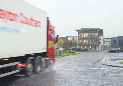  ?? Picture: Kris Miller. ?? An HGV heading for the Highland Spring factory in Blackford.