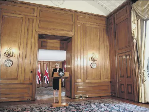  ?? PICTURES: PA WIRE. ?? UNDER SIEGE: Prime Minister Theresa May speaking in Downing Street in the aftermath of the Salzburg summit, demanding the EU respect the UK.