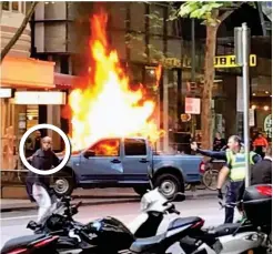  ??  ?? Terror: The assailant, circled, set fire to his car...