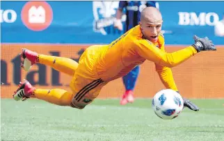  ?? PAUL CHIASSON/THE CANADIAN PRESS ?? Impact goalie Evan Bush makes a save off New England Revolution forward Teal Bunbury during Saturday’s game at Saputo Stadium. The Impact’s 4-2 win boosted their record to 3-6-0.