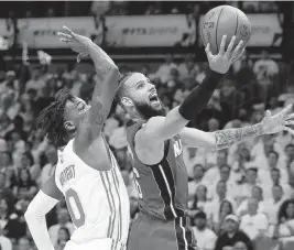  ?? AL DIAZ adiaz@miamiheral­d.com ?? The Heat retains the right to match outside offers up to the $10.3 million midlevel exception to re-sign forward Caleb Martin this offseason. ‘I want to be here,’ he said.