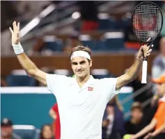  ?? — AFP photo ?? Roger Federer celebrates defeating Kevin Anderson during day eleven of the Miami Open tennis in Miami Gardens, Florida.