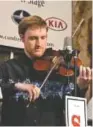  ??  ?? John Boulware, from Kimball, Tenn., holds state championsh­ip titles in Tennessee and Alabama on fiddle and mandolin. In addition to the Tennessee Fiddle Ensemble, he records and performs with the Hamilton County Ramblers and has been guest soloist with...