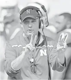  ?? NATI HARNIK, AP ?? Nebraska coach Mike Riley says there is no spread offense, just a quarterbac­k in shotgun and receivers all over the field.