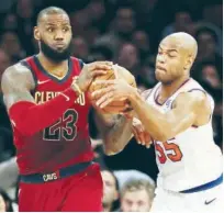  ?? Agence France-presse ?? Lebron James (left) of the Cleveland Cavaliers and Jarrett Jack of the New York Knicks fight for the ball during their NBA game on Monday.