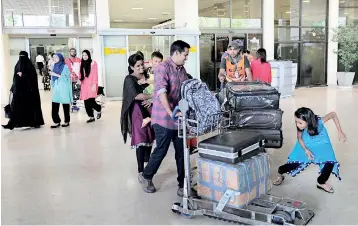  ??  ?? Returnees from Qatar: People are continuing with their routine lives