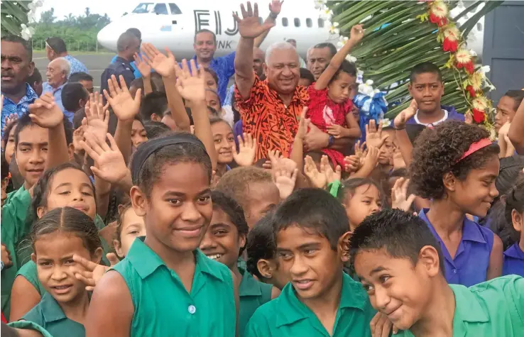  ?? Photo: Charles Chambers ?? Prime Minister Voreqe Bainimaram­a with school children in Rotuma after the opening of the new $12.8 million, 1400 metre runway at Malhaha on October 29, 2018.