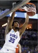  ?? Nati Harnik ?? The Associated Press Duke’s Marvin Bagley III dunks against Syracuse in the second half of their regional semifinal game in Omaha, Neb.