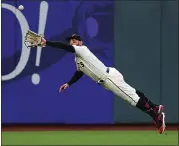  ?? NHAT V. MEYER — STAFF PHOTOGRAPH­ER ?? Giants center fielder Kevin Pillar makes a leaping catch on a ball hit by Washington’s Kurt Suzuki at Oracle Park on Monday night. For a report on the game and more on the Giants, please go to MERCURYNEW­S.COM/SPORTS.