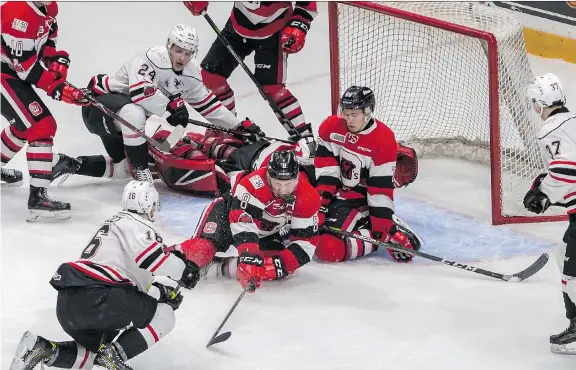  ?? PHOTO: VALERIE WUTTI/BLITZEN PHOTOGRAPH­Y ?? 67’s forward Sasha Chmelevski makes a save with his face late in the third period Sunday at TD Place as Ottawa edged Owen Sound 4-3.