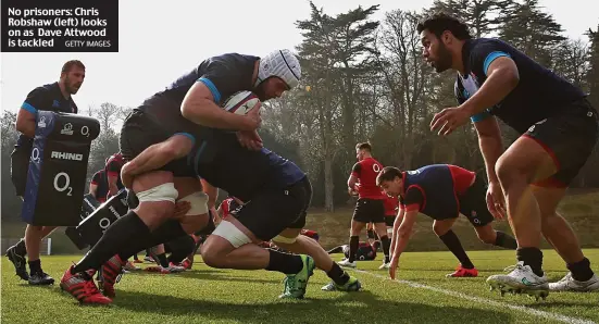  ?? GETTY IMAGES ?? No prisoners: Chris Robshaw (left) looks on as Dave Attwood is tackled