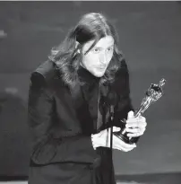  ?? AP PHOTO ?? Ludwig Goransson accepts the award for best original score for “Oppenheime­r” during the Oscars on Sunday, March 10, 2024, at the Dolby Theatre in Los Angeles.