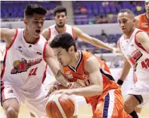  ??  ?? BEING SCRAPPY has been Alaska’s mentality to winning games as shown in this photo where three Aces defenders try to hound Anjo Caram of Meralco.